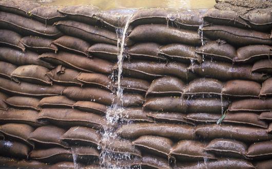 Adobe stock picture of sandbags being used to hold back floodwaters
