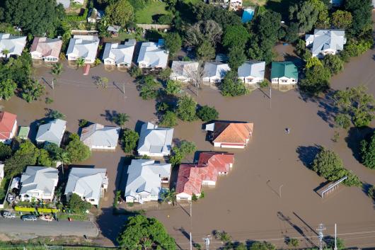 Flooded houses from the air. Image: Adobe stock