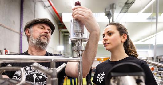 Young Henrys' co-Founder Richard Adamson works with UTS PhD student Laryssa Raffa to analyse the operations of the Industry 4.0 brewery.