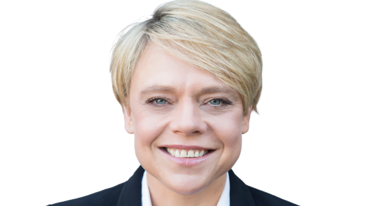 Headshot of Dr Sally Cripps- blonde hair, blue eyes, wearing a black suit. 