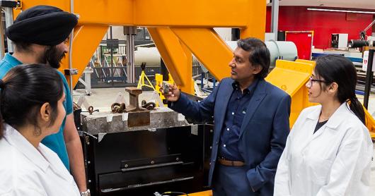 Professor Buddhima Indraratna and his team with track testing apparatus at UTS Tech Lab