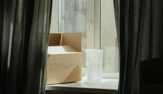 a cardboard box on a windowsill
