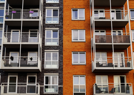 Grey and orange brick inner-city apartment blocks