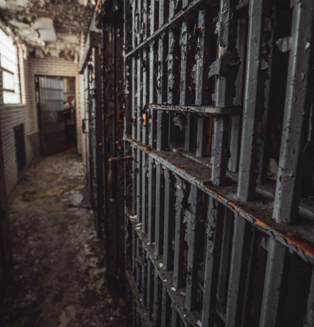 Dilapidated prison cell and doors