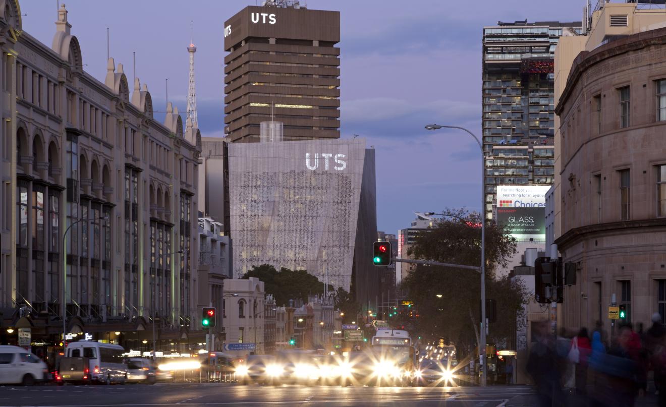 Street level photo of the UTS campus from Broadway (road) showing Building 11 and Building 01 in the dusk