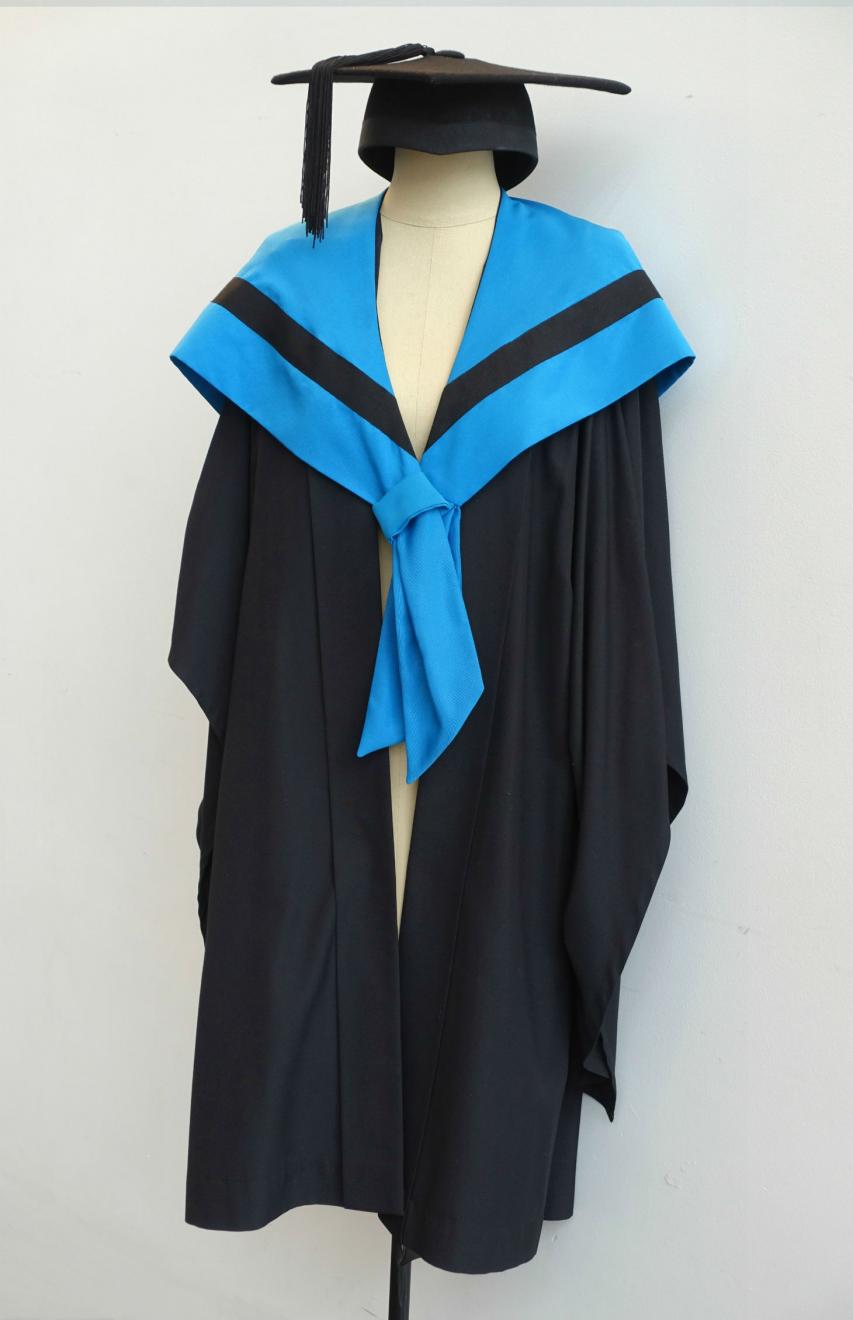 Black Bachelor gown, electric blue Bachelor hood for Information Technology and a black trencher