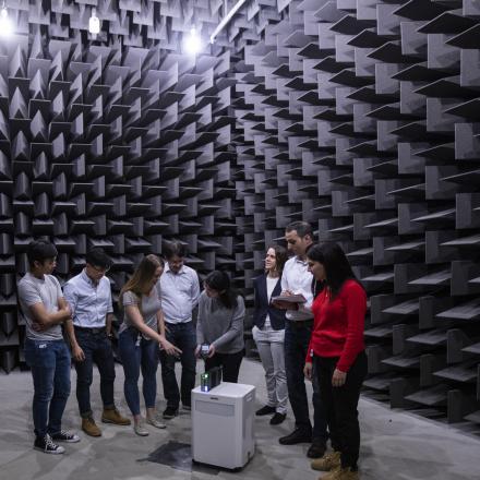 People looking around in an acoustic chamber