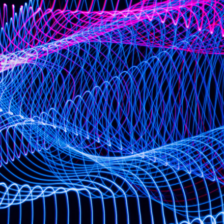 blue and pink abstract overlapping waves of light