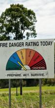 A fire danger rating sign with arrow