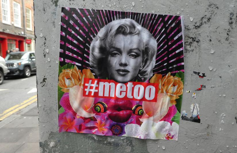 A poster featuring a black and white photograph of Marilyn Monroe, with '#MeToo'