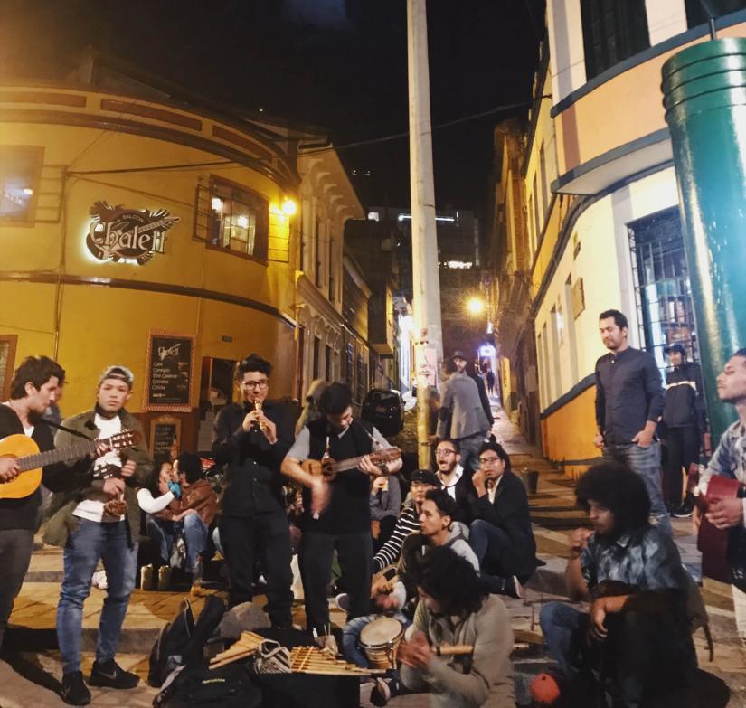A group of people on the street in Chile at night enjoying the El Dieciocho celebrations