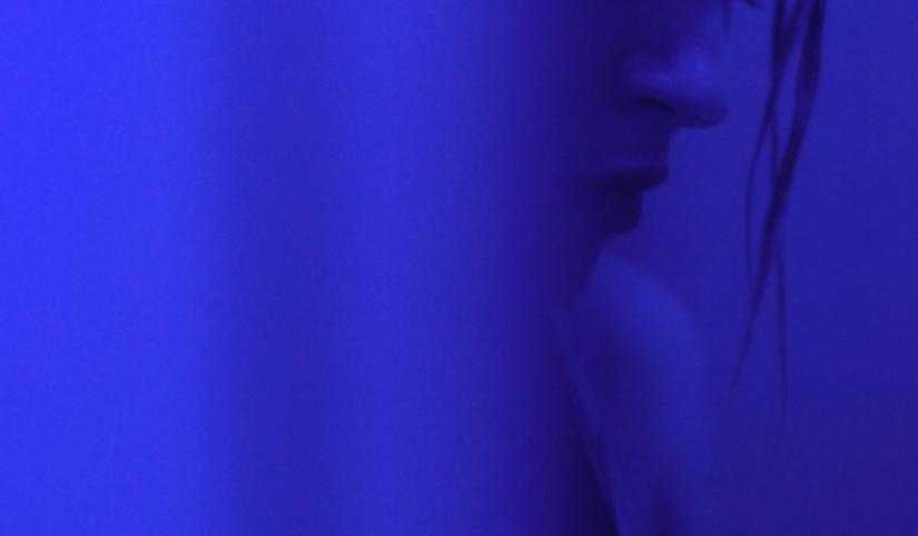 Still from Christel's film Pussy Politics featuring a close up of a woman in profile