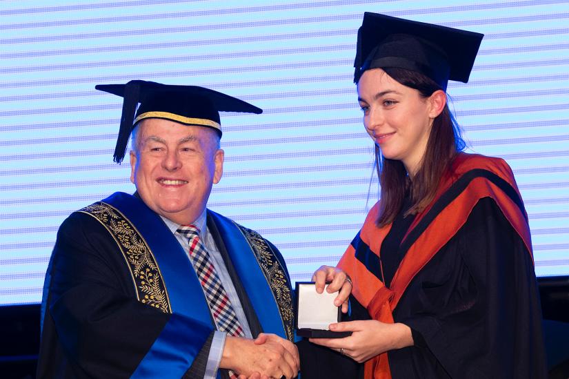 Freya being awarded the medal by the UTS Chancellor