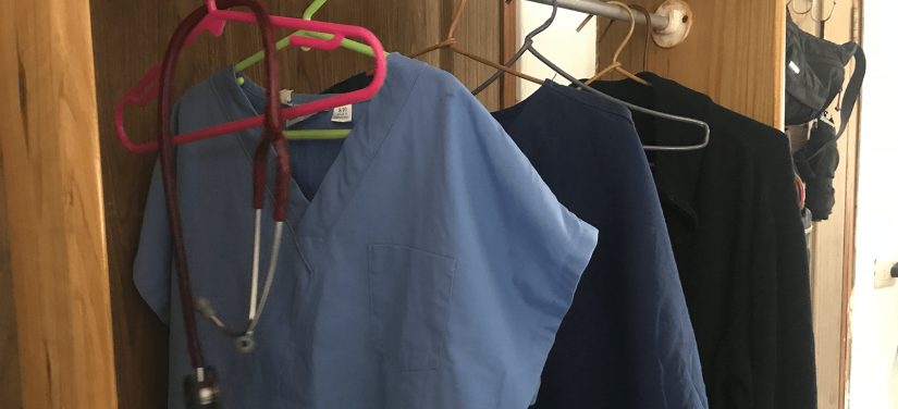 Nurse uniform hanging in a cupboard