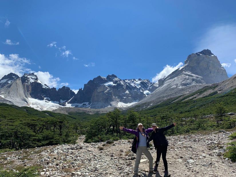 Velvet-Belle and Alicia posing in front of a mountain range