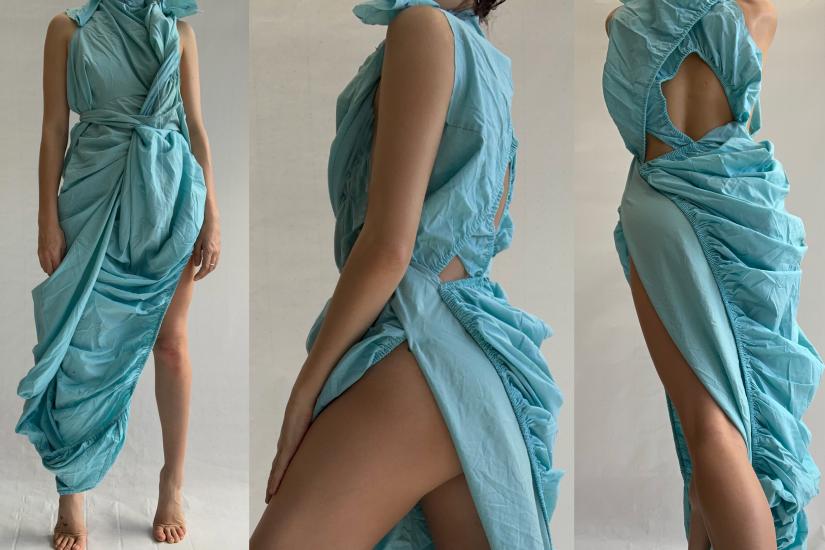 Image of a woman wearing a design exploration for a dress made from a fitted bedsheet