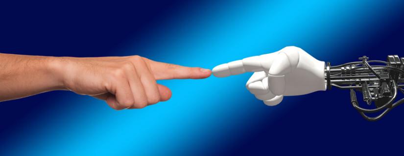 human hand outstretched, touching a robot hand