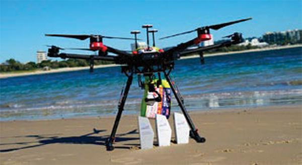 Sharkspotter drone on beach with awards