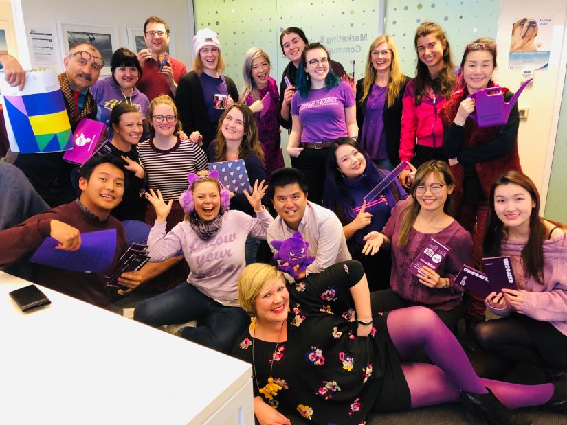 Staff from the UTS Marketing and Communications Unit wearing purple.