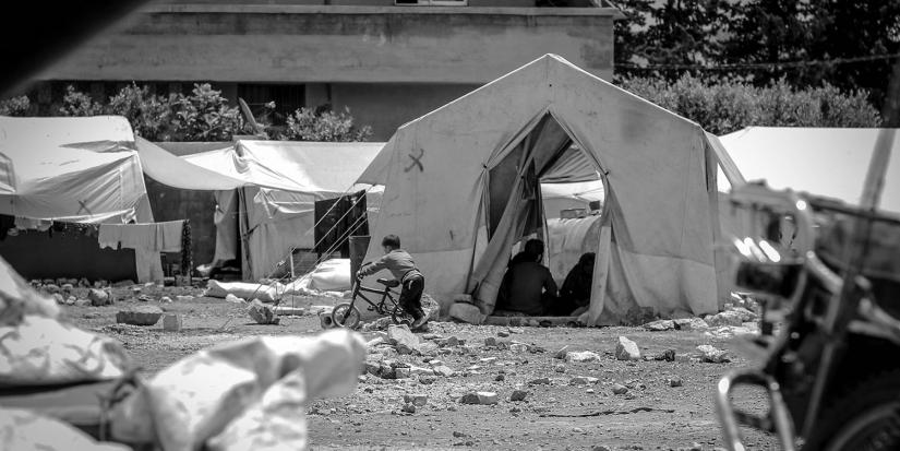 Black and white image of a refugee camp