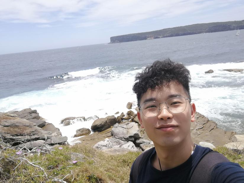 A photo of BoYan near the ocean.