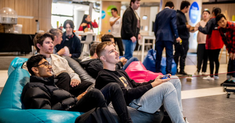 Esports club students gaming on beanbags