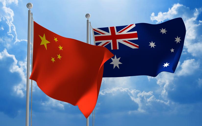 Australia and China flag against blue sky