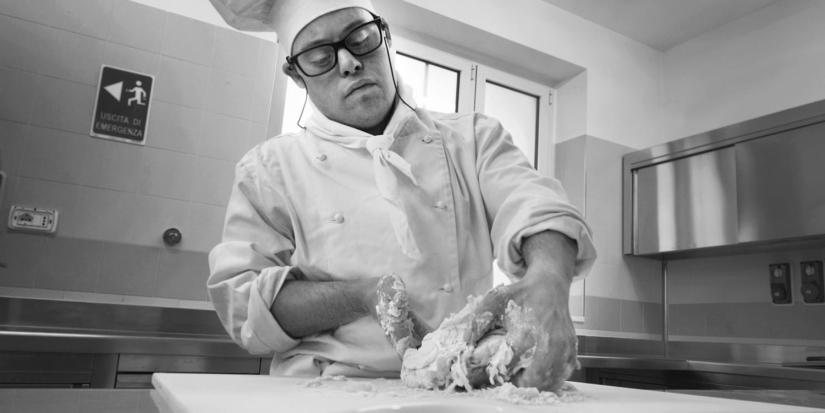 Person with intellectual disability cooking in the kitchen.