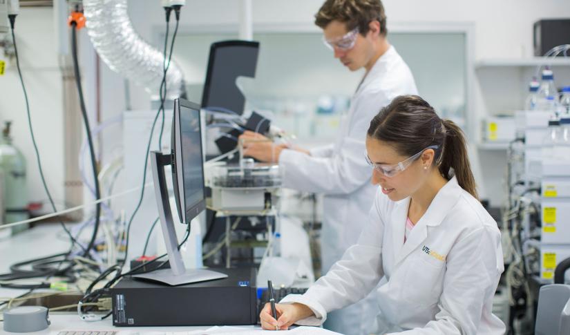 Two researchers working in lab