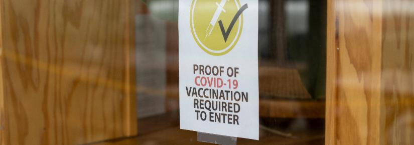 Proof of vaccination required poster. Image: Adobe Stock