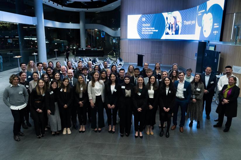 Large group of participants pose at the Law Tech Challenge