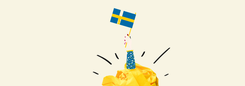 A cartoon hand holding a Swedish flag pops out of a scrunched up piece of yellow paper