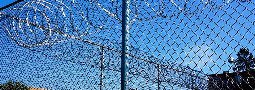 Stock picture of a detention centre fence line
