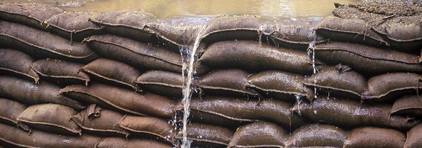 Adobe stock picture of sandbags being used to hold back floodwaters