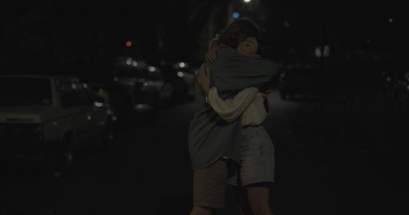 Finn and Amber hug, from Swings & Roundabouts