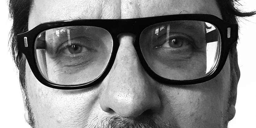 Close up on Prof. Carl Rhodes' eyes, glasses and nose.