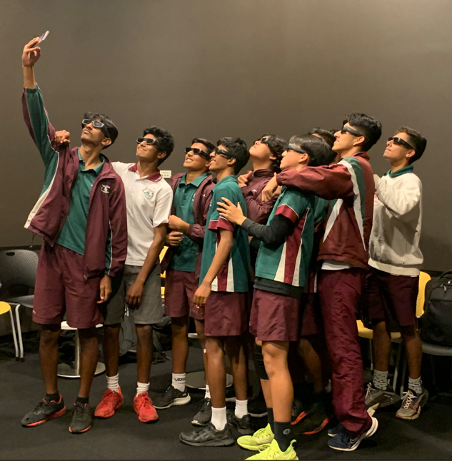 a group of Macquarie Fields High School students wearing 3D glasses about to enter the UTS Data Arena. 