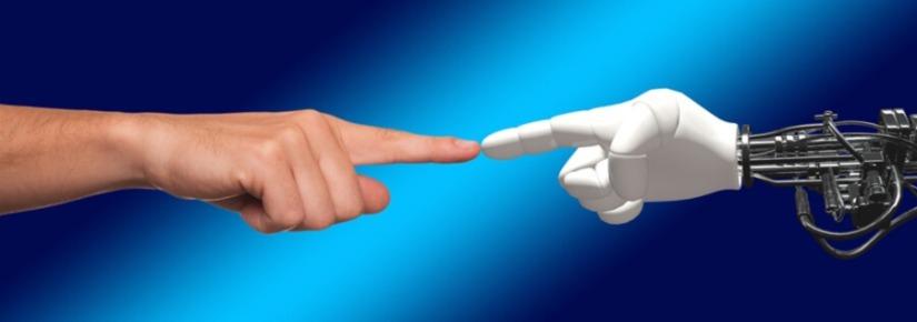 robot hand and human hand touching index fingers