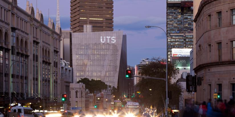 A look down Broadway with the UTS sign prominent at dusk.