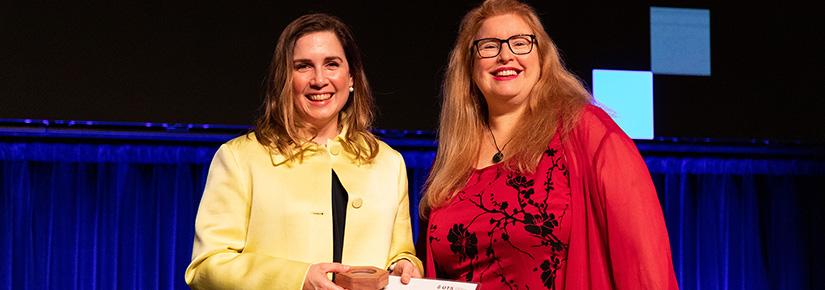 Sally Inglis receives the UTS Medal for Research Impact from Professor Kate McGrath