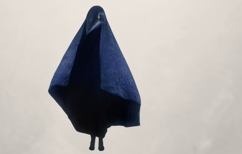 Image of a black, beaked character wearing a large cape.