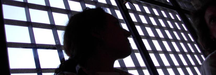 woman in prison. Image: Adobe Stock