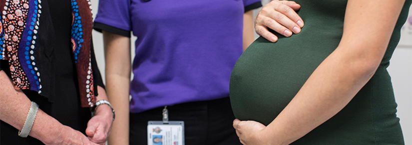 UTS Midwifery student and lecturer stand with pregnant woman