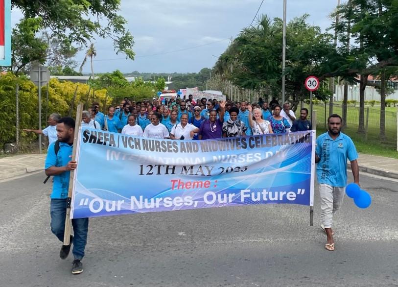 Nurses holding a banner for International nurses day