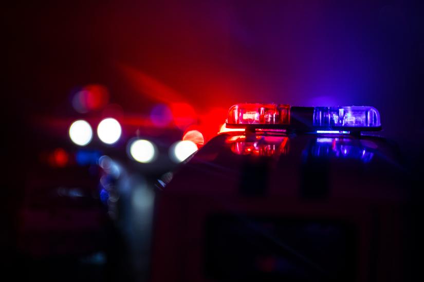 The blue and red lights of a police car flashing