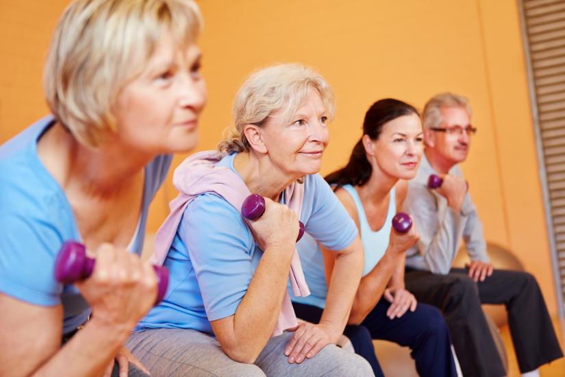 seniors with weights in a fitness centre