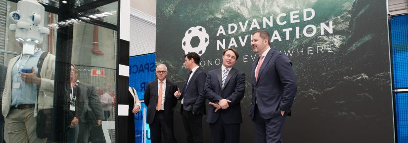 Malcolm Turnbull and Ed Husic with the founders of Advanced Navigation as they stand near an underwater drone display.