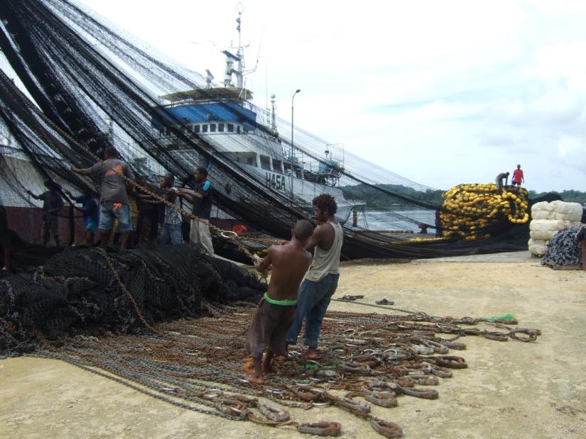Men pulling in fishing nets