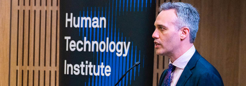 Image of Ed Santow speaking alongside Human Technology Institute banner