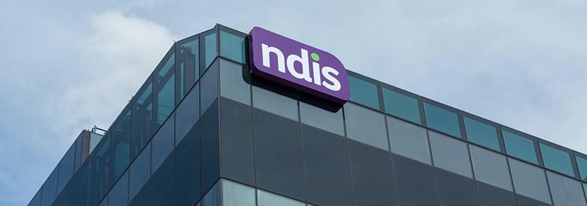 Stock picture of a building parapet with the NDIS logo